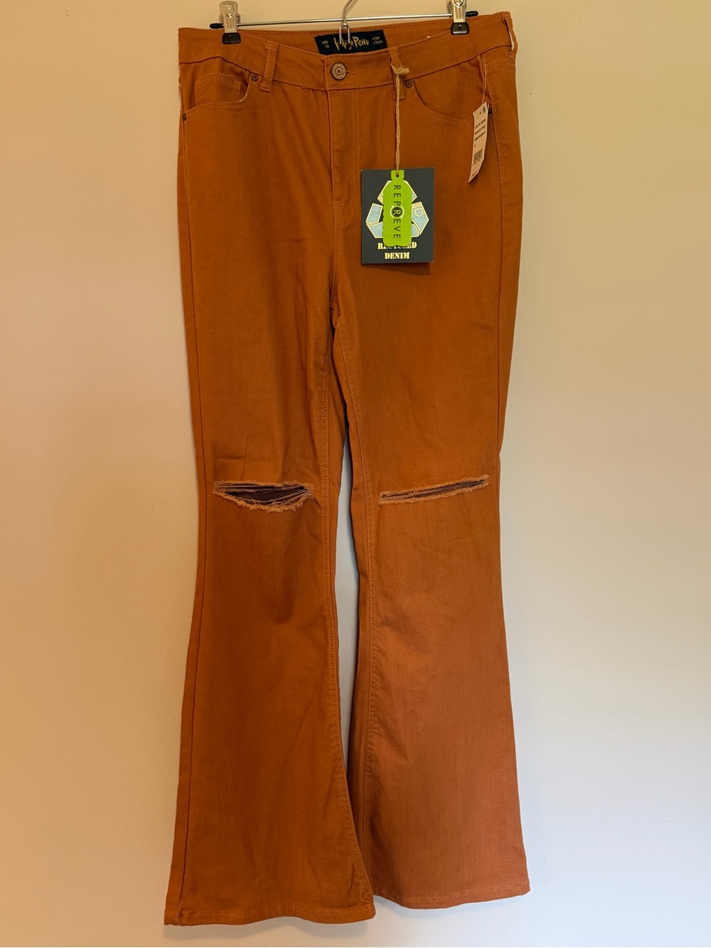 Indigo Rein Women's Flare Jeans in Burnt Orange with Knee Rips